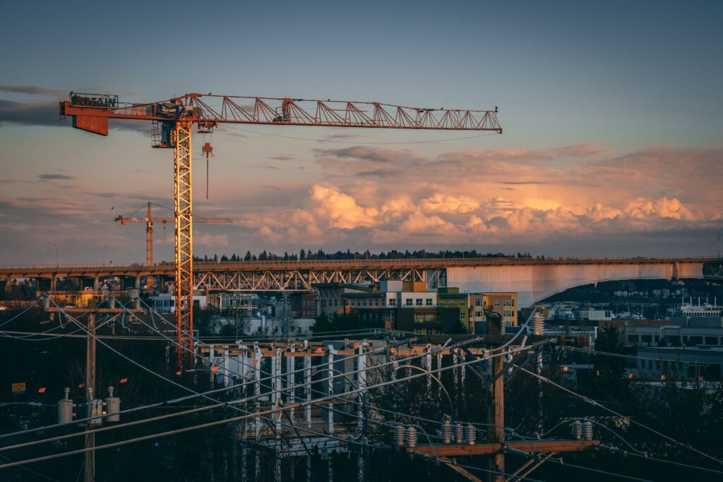 A beautiful view of a construction site in a city during sunset